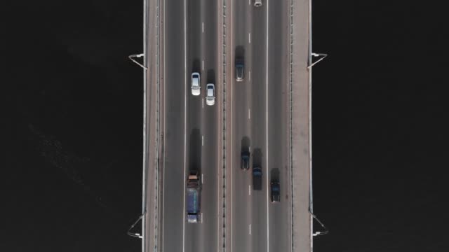 Highway-bridge-traffic-aerial-top-view-time-lapse-high-speed-cars