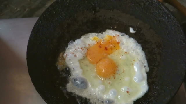 Half-fried-egg-in-pan