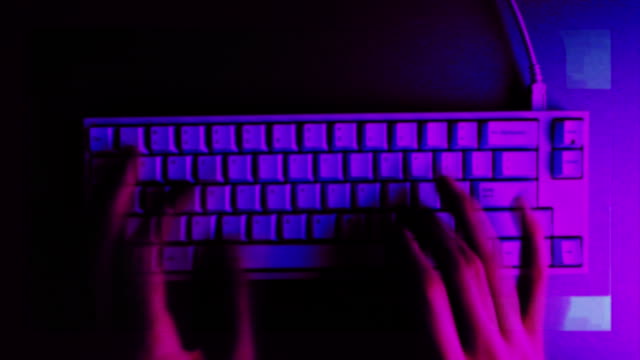 Keyboard-typing---fast-stop-motion.-Computer-cyber-crime-concept.-Freelancer-coding-in-the-dark-room.-Modern-business-technology.-Hacker-DDoS-attack.