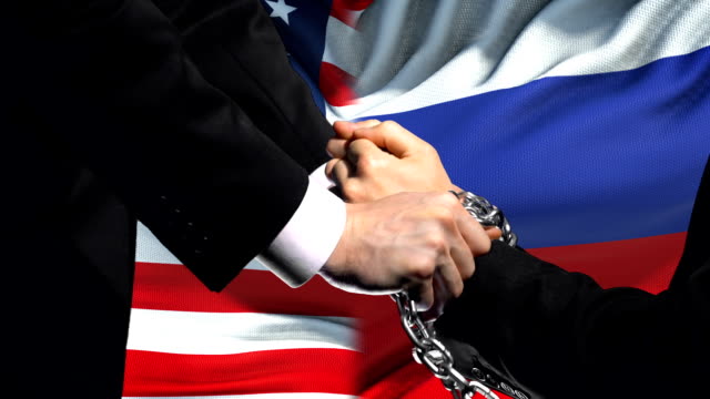 United-States-sanctions-Russia,-chained-arms,-political-or-economic-conflict