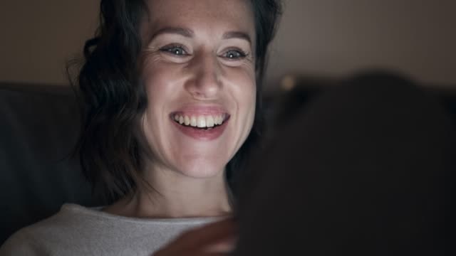 Woman-enjoying-media-content-on-digital-tablet