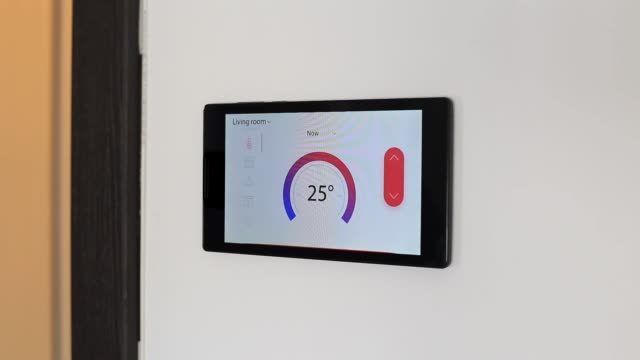Smart-home-climate-control-device-on-a-wall