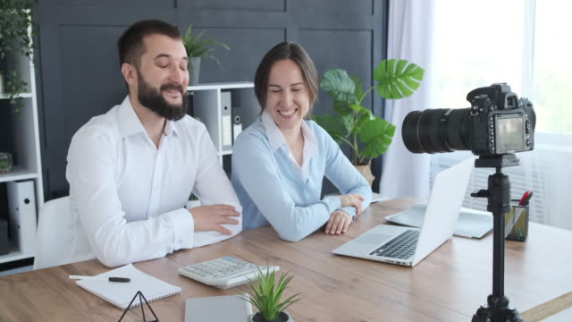 Happy-business-couple-recording-new-video-for-vlog