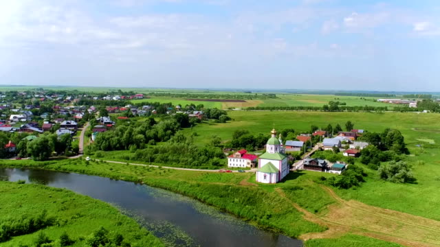Aerial-shot-Elias-Church-on-the-river-Kamenka-in-Suzdal,-Russia