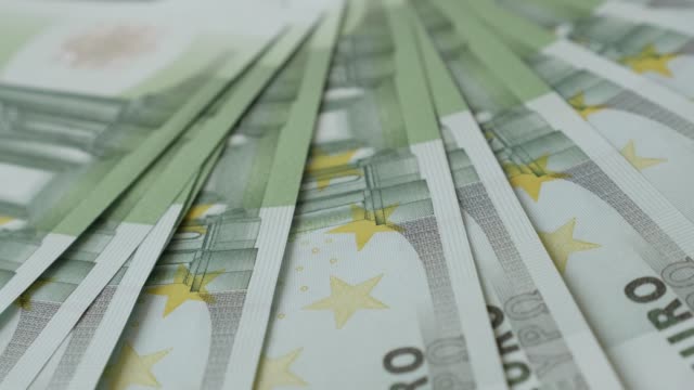 European-Union-Euros-drop-on-table-close-up