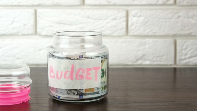 Budget.-Glass-jar-with-cash.