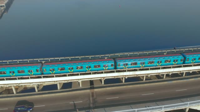 Subway-train-ride-over-bridge-crossing-river