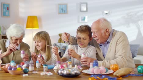 Grandchildren-Painting-Easter-Eggs-with-Grandparents