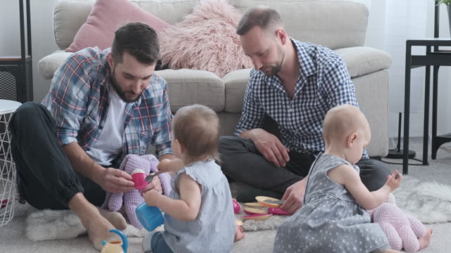 Fathers-and-baby-daughters-playing-at-home