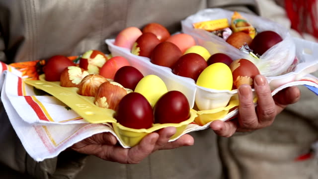 Grandmother-holds-the-easter-eggs
