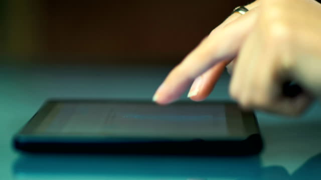 Close-up-of-a-hands-of-a-young-girl-writes-a-letter-by-e-mail-on-the-tablet.-4K.
