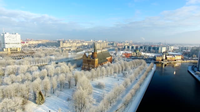 Aerial:-The-Cathedral-in-the-snow-capped-city-of-Kaliningrad,-Russia