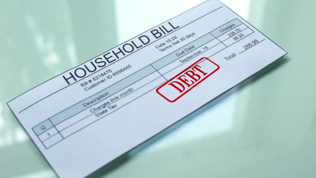 Household-bill-debt,-hand-stamping-seal-on-document,-payment-for-services
