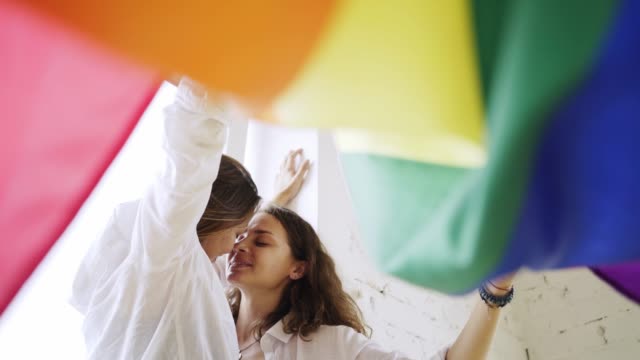 Women-wrapped-in-rainbow-flag