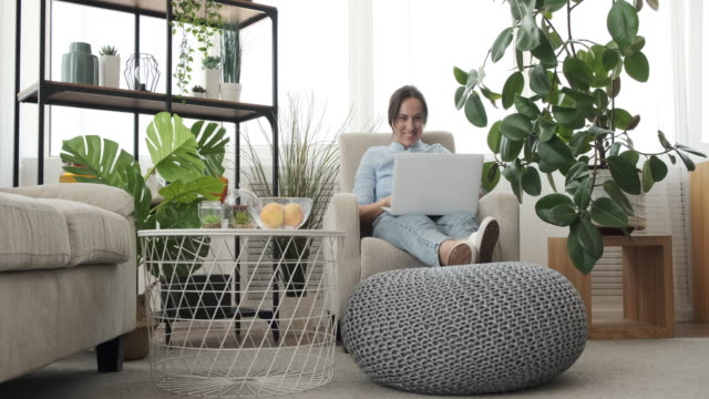 Surprise-woman-using-laptop-at-home