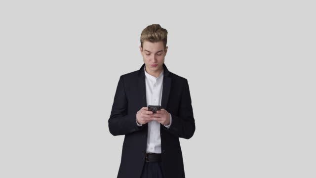 Businessman-text-messaging-on-mobile-phone