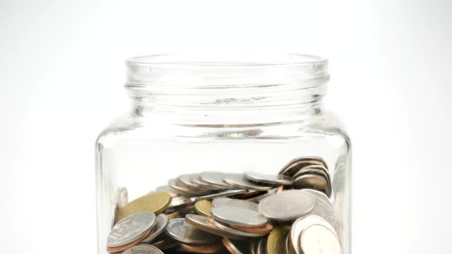 save-money-for-investment-concept-thai-coins-in-a-glass-jar