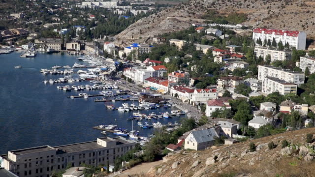 Panorama-view-of-Balaclava-from-ancient-fortress-Chembalo.-Balaclava-Bay-with-yachts-in-bright-sunny-day.-Crimea