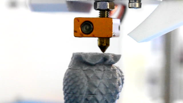3D-printer-prints-a-figure-close
