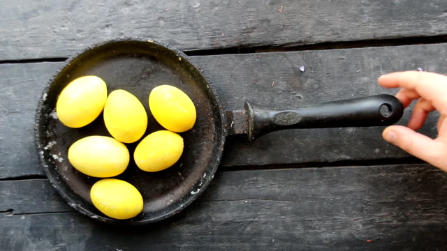 Yellow-Easter-eggs-on-wood-table