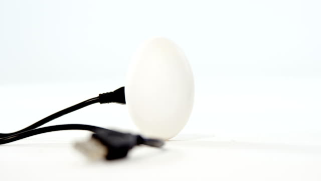 Chord-connected-to-easter-eggs-on-white-background