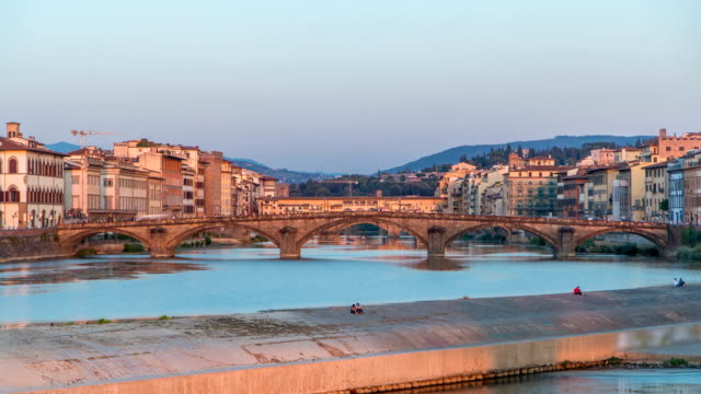 Scenic-Sunset-Skyline-timelapse-View-of-Tuscany-City,-Housing,-Buildings-and-Ponte-alla-Carraia-and-Arno-River,-Florence,-Italy