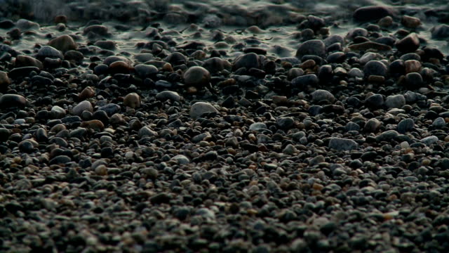 Maritime-pebble-on-a-background-of-the-sea-at-sunset.