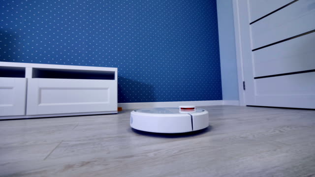 A-robotic-vacuum-cleaner-starts-its-routine-from-the-door.