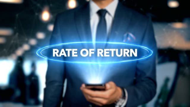 Businessman-With-Mobile-Phone-Opens-Hologram-HUD-Interface-and-Touches-Word---RATE-OF-RETURN