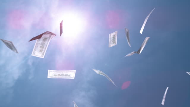 SLOW-MOTION-CLOSE-UP:-Money-hundred-$-dollar-bills-falling-down-from-blue-skies