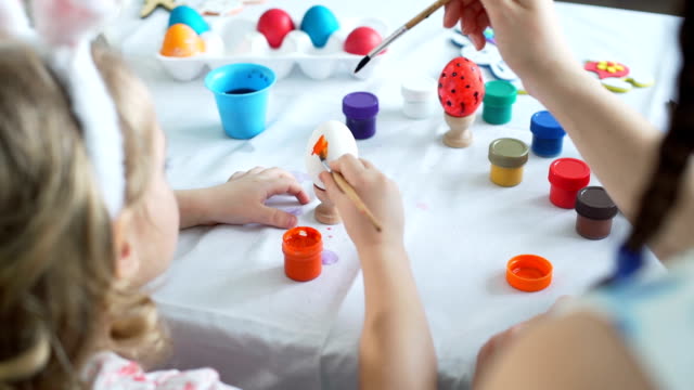 Painting-with-Brushes-on-Easter-Egg