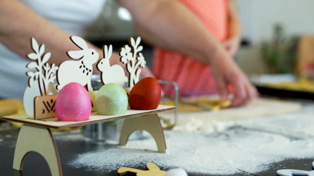 Little-Girl-and-Grandma-Cutting-Easter-Cookies