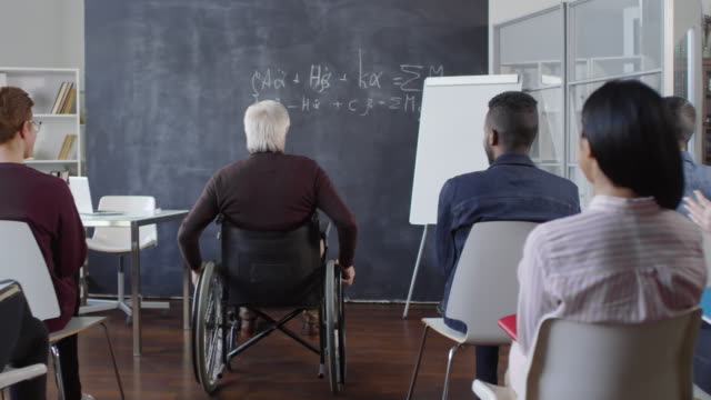 Students-Greeting-Disabled-Professor-in-Classroom