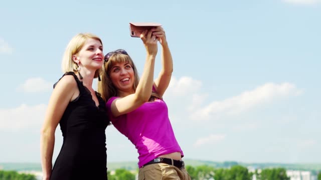 two-girls-are-photographed-on-the-phone