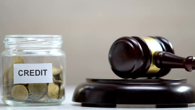 Credit-jar-with-coins,-judge-striking-gavel,-debt-collection,-payment-problems