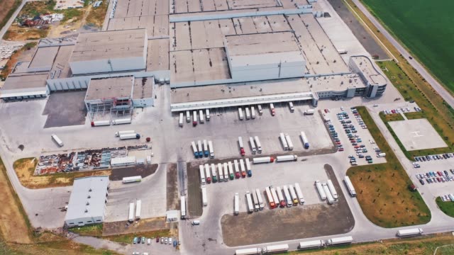 Aerial-view-of-warehouse-with-trucks.