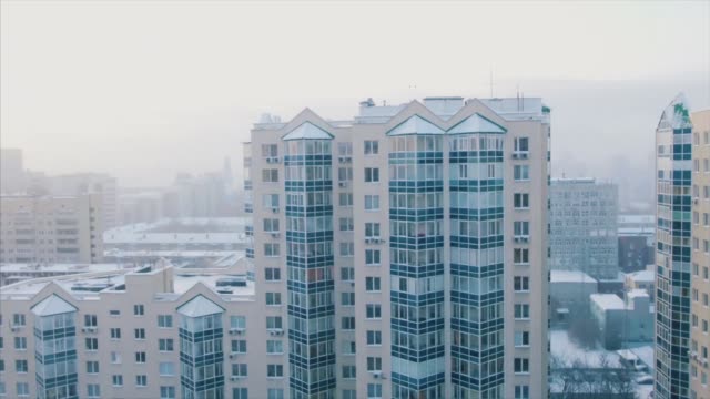 Panoramic-view-of-the-snow-covered-apartment-building.-Modern-residential-districts-in-city,-winter-landscape