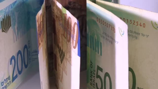 Israeli-money,-shekels-bills-in-motion