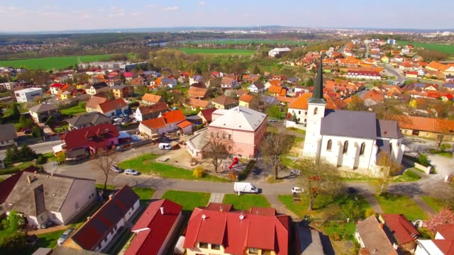 Camera-flight-over-small-village-Litice-suburb-of-Pilsen.-Living-in-agricultural-landscape.-Environmentally-friendly-living.-Czech-Republic,-Europe.