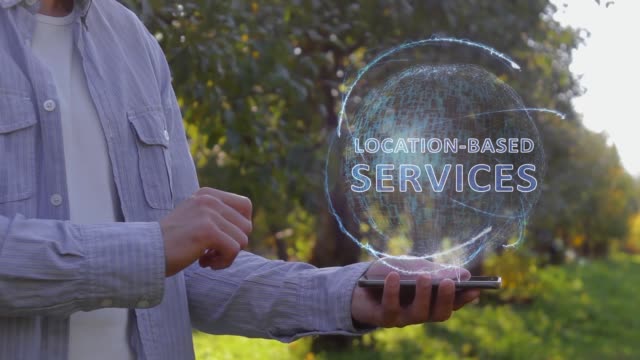 Man-shows-hologram-with-text-Location-based-services