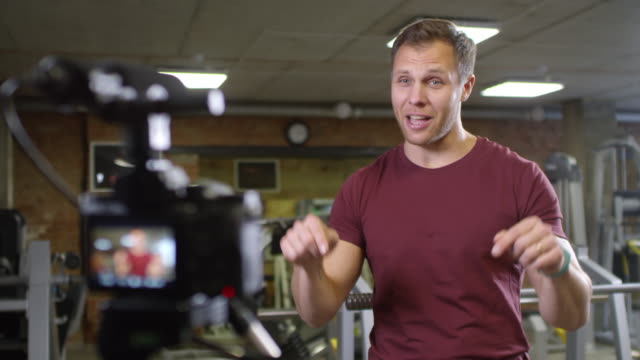 Gym-Coach-Recording-Video-for-Fitness-Vlog