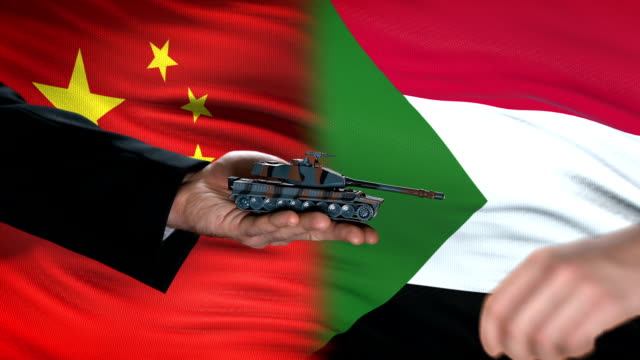 China-and-Sudan-officials-exchanging-tank-for-money,-flag-background,-security