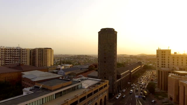 View-from-quadrocopter-to-vehicles-movement-near-Yerevan-City-Hall,-golden-hour