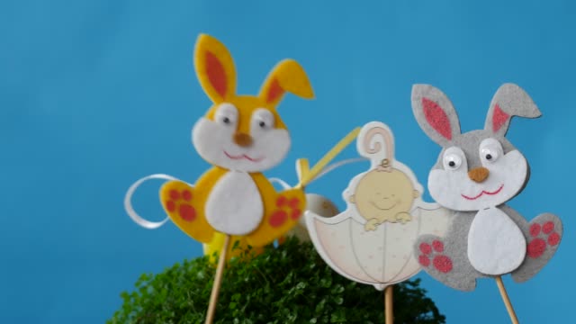 The-Easter-bunnies-found-Easter-eggs-and-baby-in-umbrella.