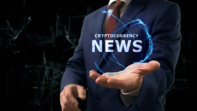 Businessman-shows-concept-hologram-Cryptocurrency-news-on-his-hand