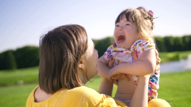 Mom-and-down-syndrome-daughter-enjoying-outdoors