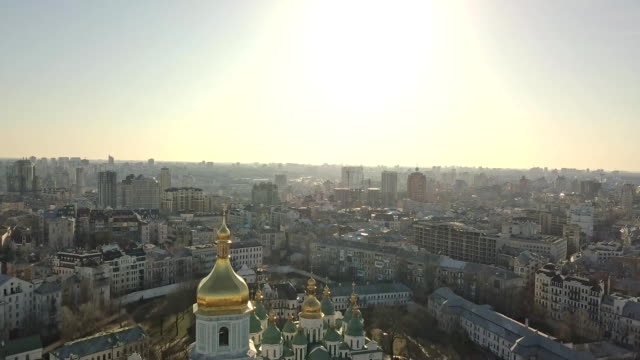 A-bird's-eye-view-video-from-the-drone-in-FullHD-to-the-central-bell-tower-Saint-Sophia's-Cathedral-in-the-city-Kiev,-Ukraine.-Pedestal-down-slow-video.