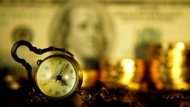 Management-efficiency.-Increasing-stacks-of-golden-coins-on-dollar-note-background.-Retro-clock-and-soft-focus