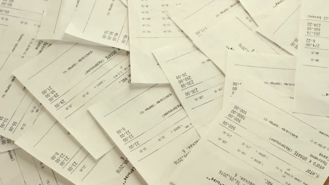 Woman-Sorting-Receipts.-Track-Spending