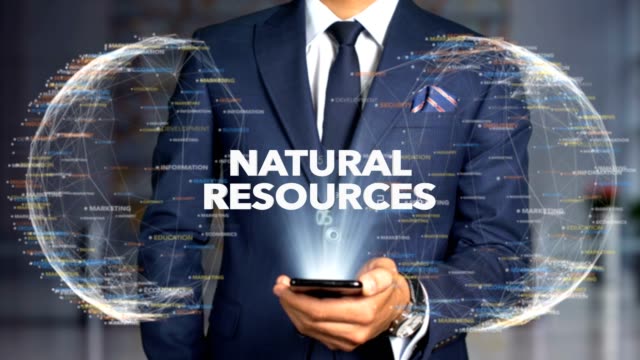 Businessman-Hologram-Concept-Economics---Natural-resources